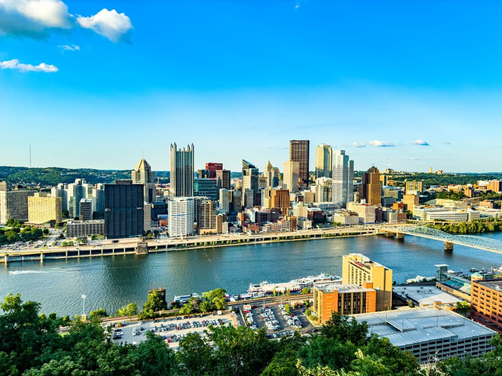 The striking skyline of Pittsburgh emerging from the confluence of three rivers