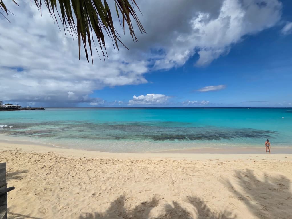 Maho Beach, Sint Maarten - cruise ship and beachgoers at sunset