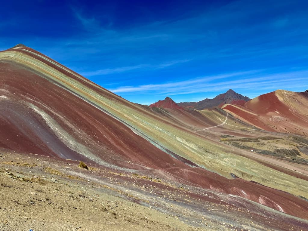 Vinicunca’s wild colors under a stormy sky