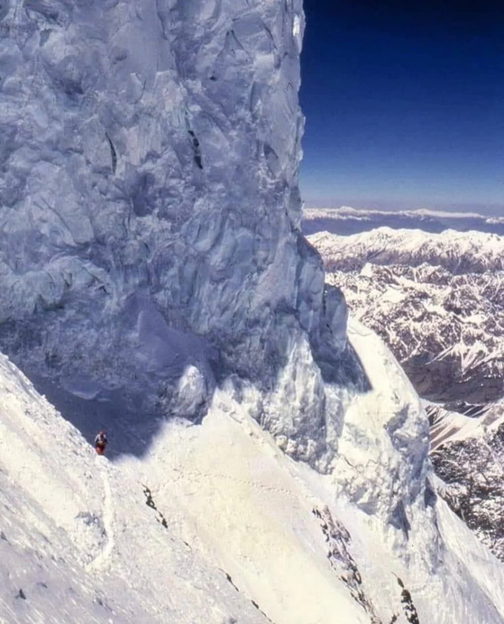 The surreal sand dunes of the Sarfaranga Cold Desert, with snowy peaks in the background