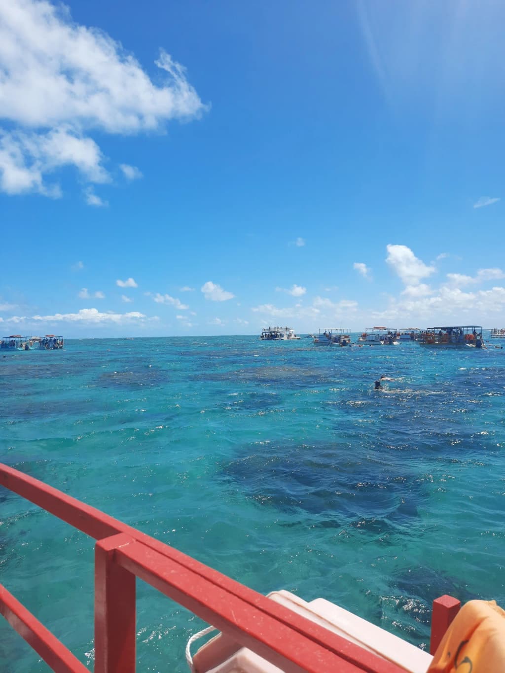 Snorkelers exploring the coral reefs at Parrachos de Maracajaú