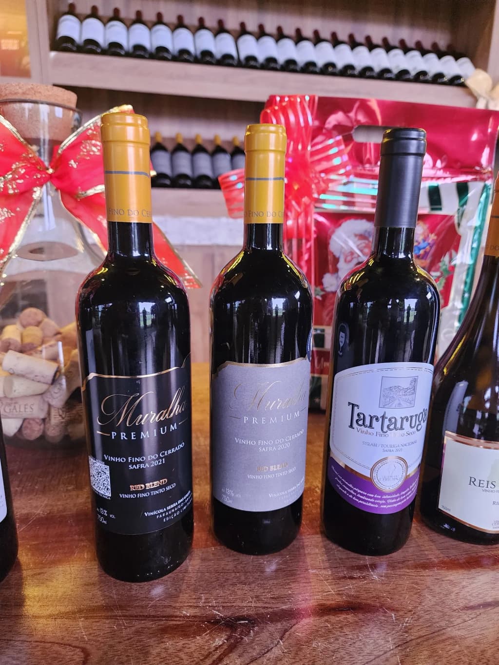 A rustic farmhouse surrounded by greenery, with dogs resting nearby