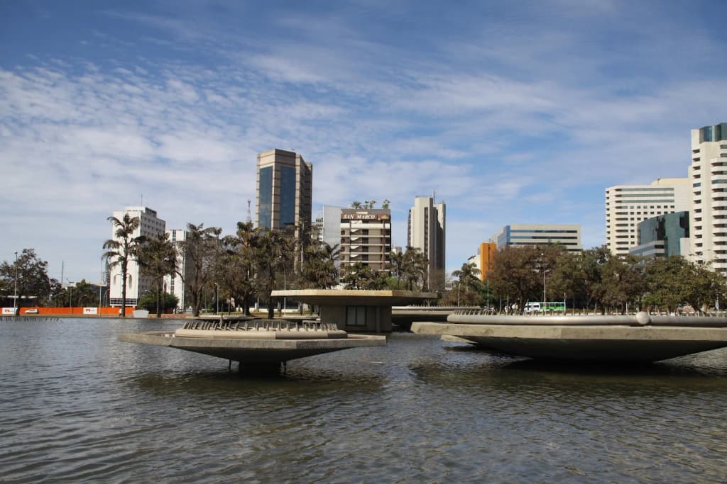 Inside the Gruta dos Brejões, sunlight streaming through a massive cave opening
