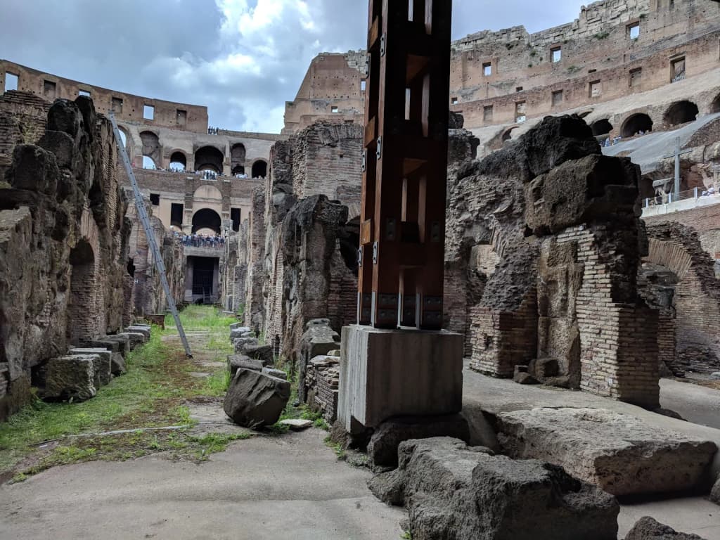 Traveler standing in front of the Colosseum, ready for adventure