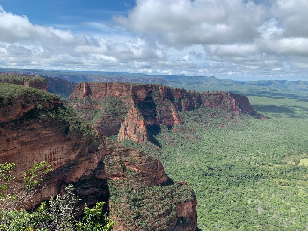 Waterfall plunging into a lush pool in Chapada dos Guimarães
