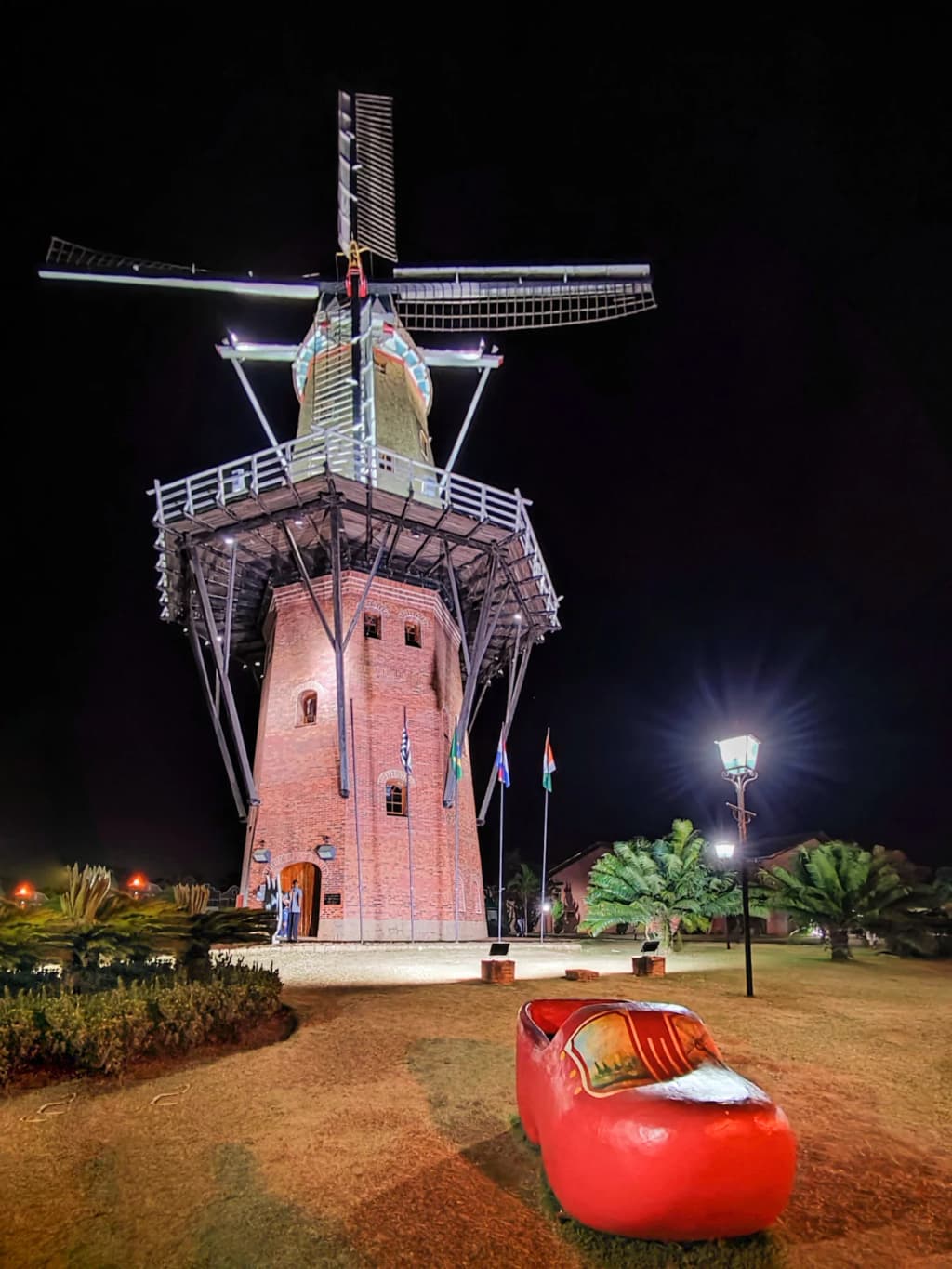 Moinho Povos Unidos windmill in Holambra, Brazil, with blue sky and tulip beds