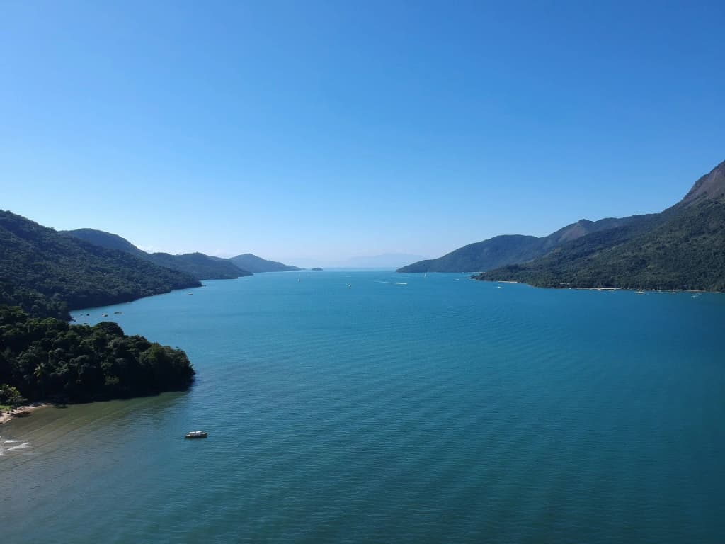 Mamanguá Bay with misty mountains and calm water