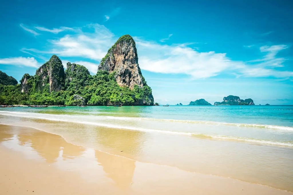 Towering limestone cliffs and turquoise water at Railay Beach