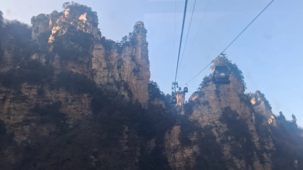 Tianzi Mountain’s sandstone pillars rising through mist