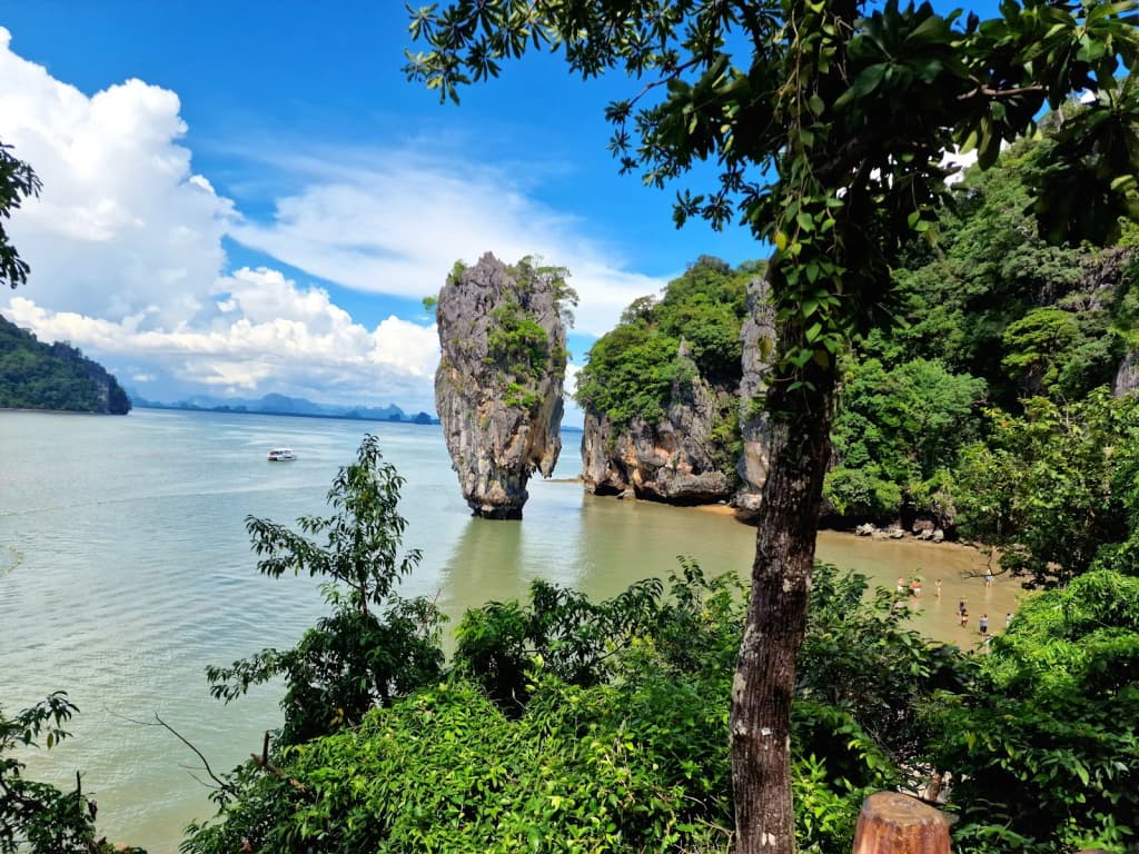 Towering limestone cliffs and turquoise water at James Bond Island