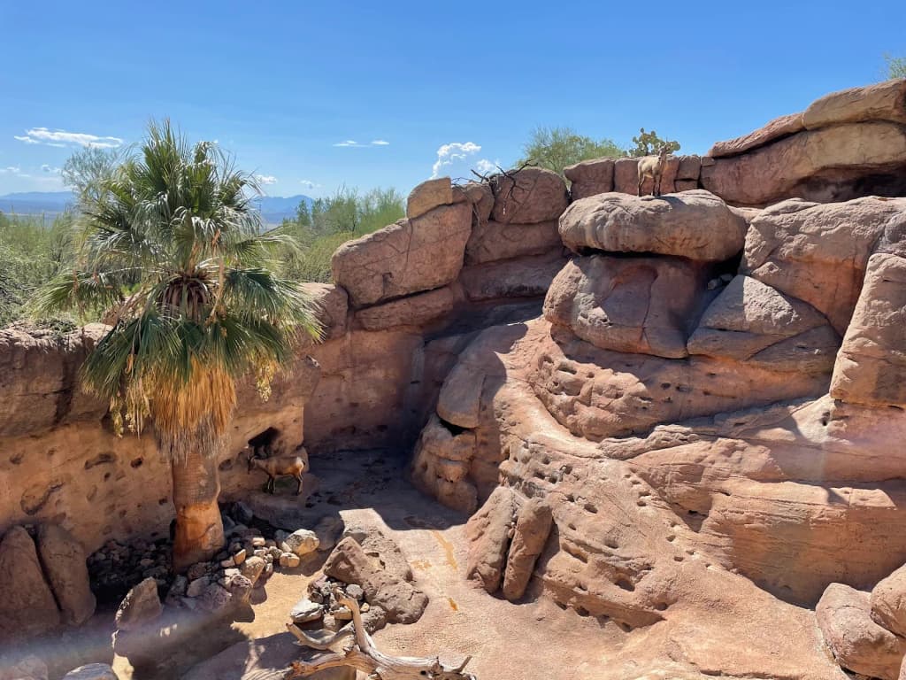 Red sandstone towers rise from the desert floor in Monument Valley
