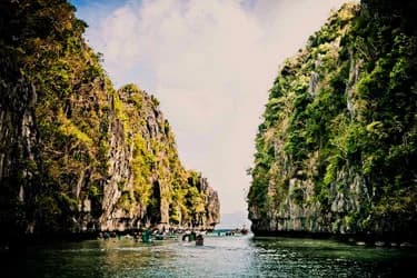 Secret lagoon surrounded by limestone cliffs in El Nido, Palawan