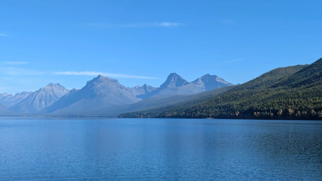 Sunset over a mountain lake with pine forests in Montana