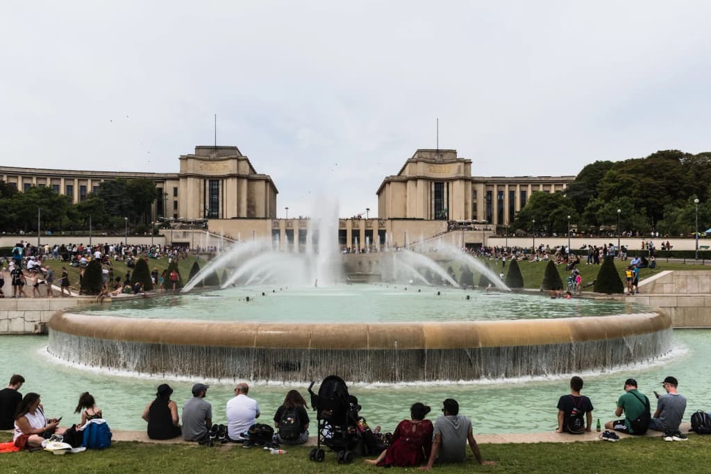 A fridge covered in touristy magnets, including the Eiffel Tower and Colosseum