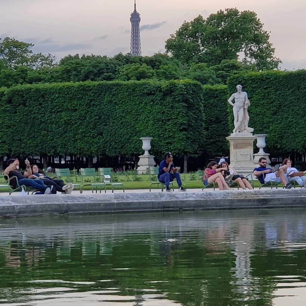 Locals picnicking by the Seine at sunset, Paris