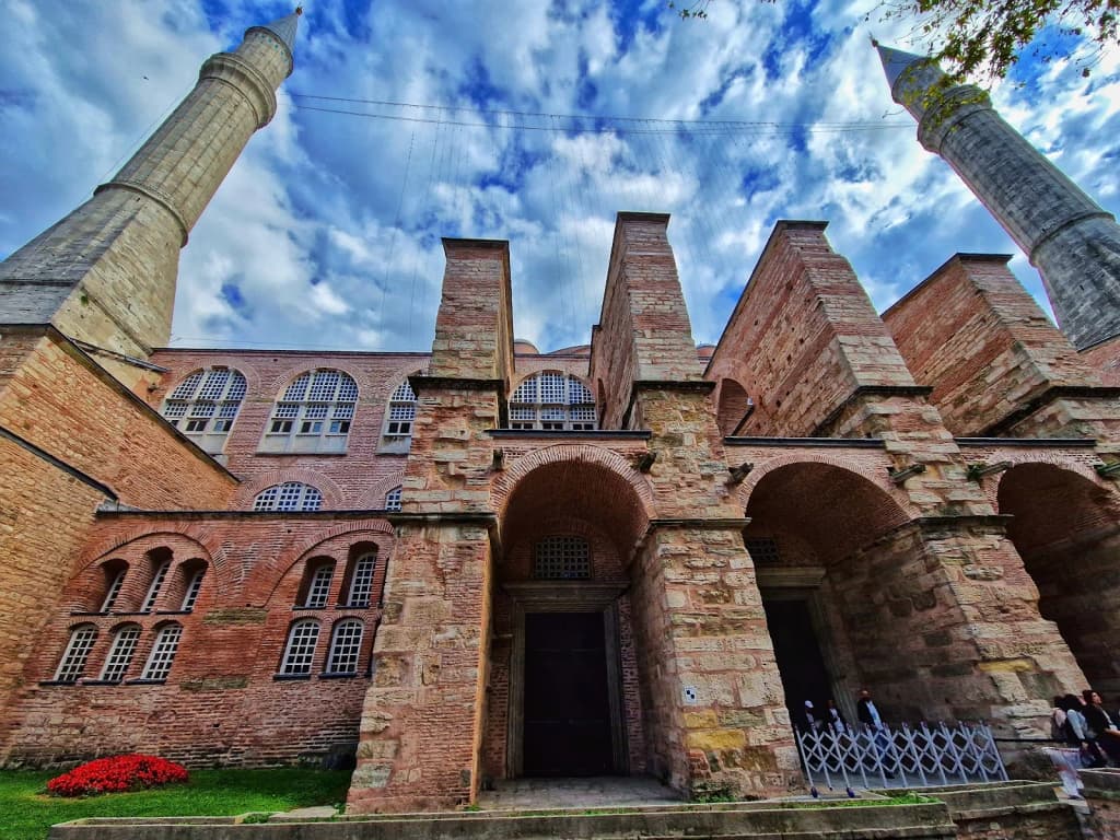 The view from Galata Tower at sunset, domes and minarets silhouetted against the glowing sky.