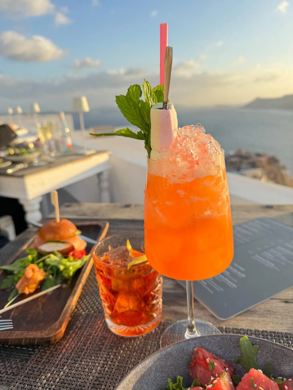 Santorini sunset over Oia's whitewashed cliffs