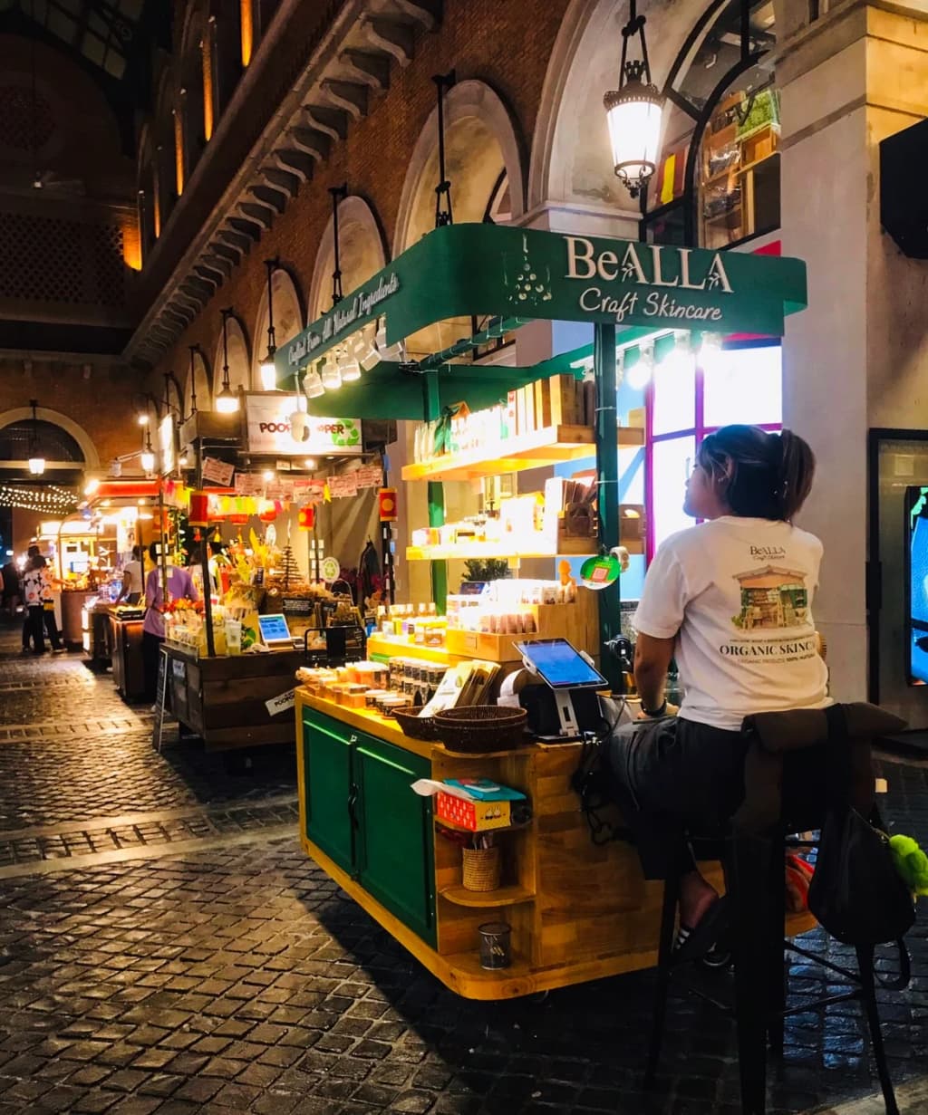 Crowds releasing glowing lanterns into the night sky at the festival