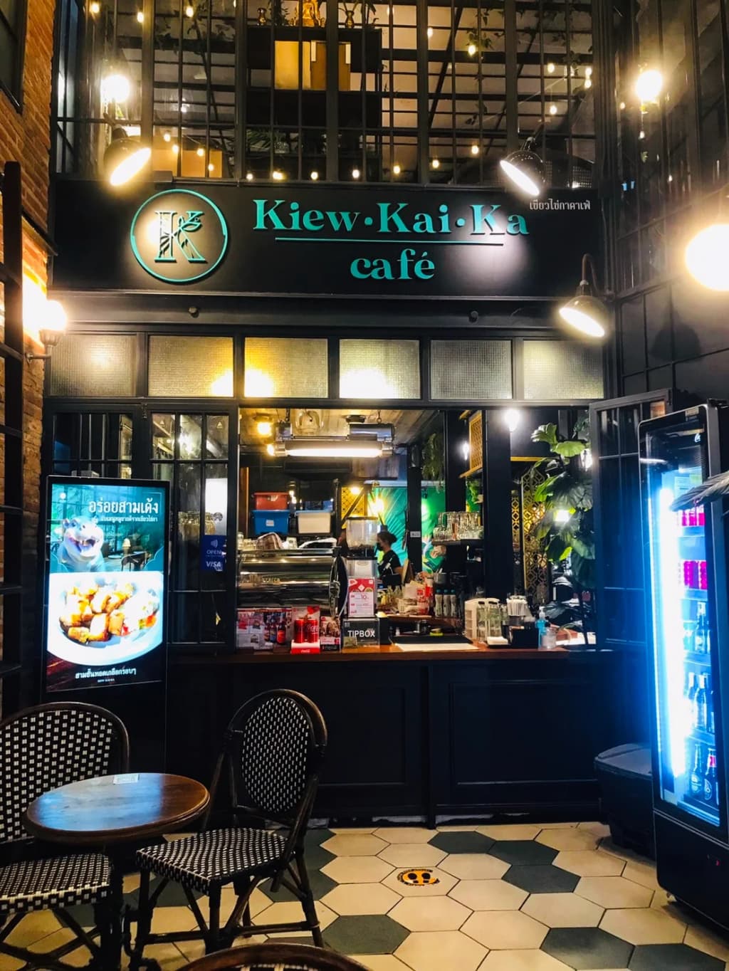 Krathongs—flower boats with candles—float on a lake at night during Loi Krathong