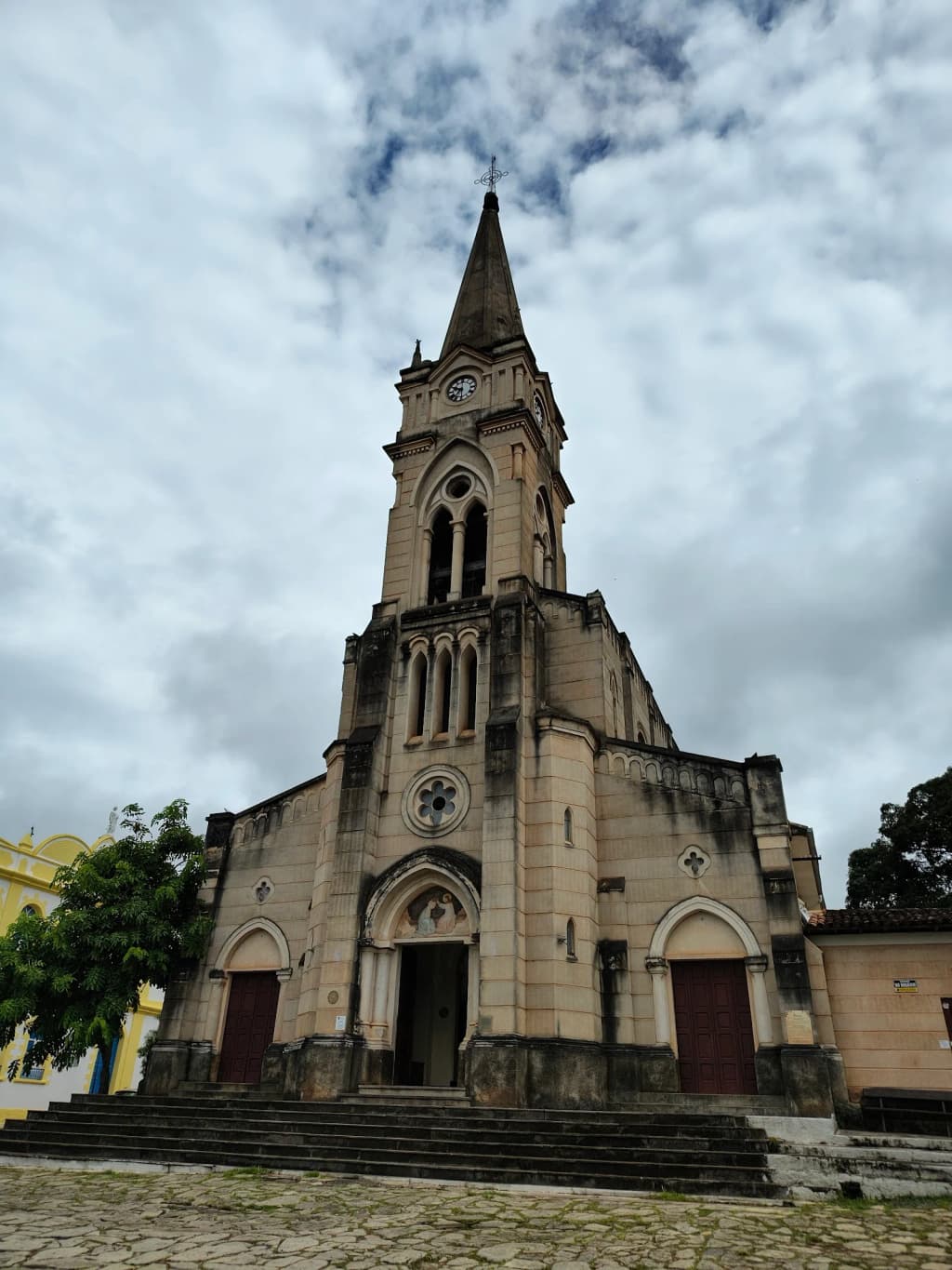 A family-run ice cream shop with vintage decor and a display of fruit-flavored ice creams.