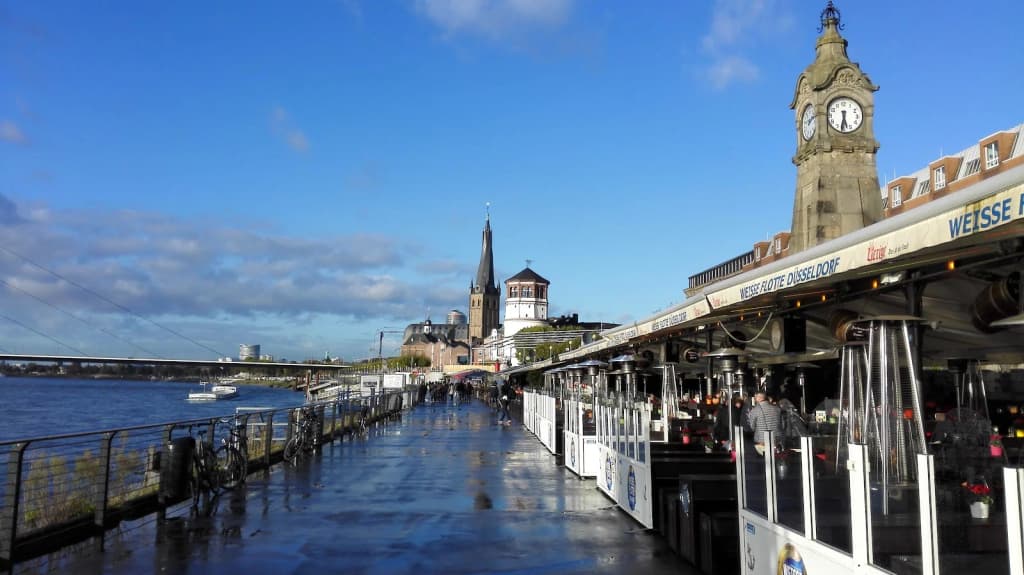 Chic European outlet village with designer stores and empty walkways