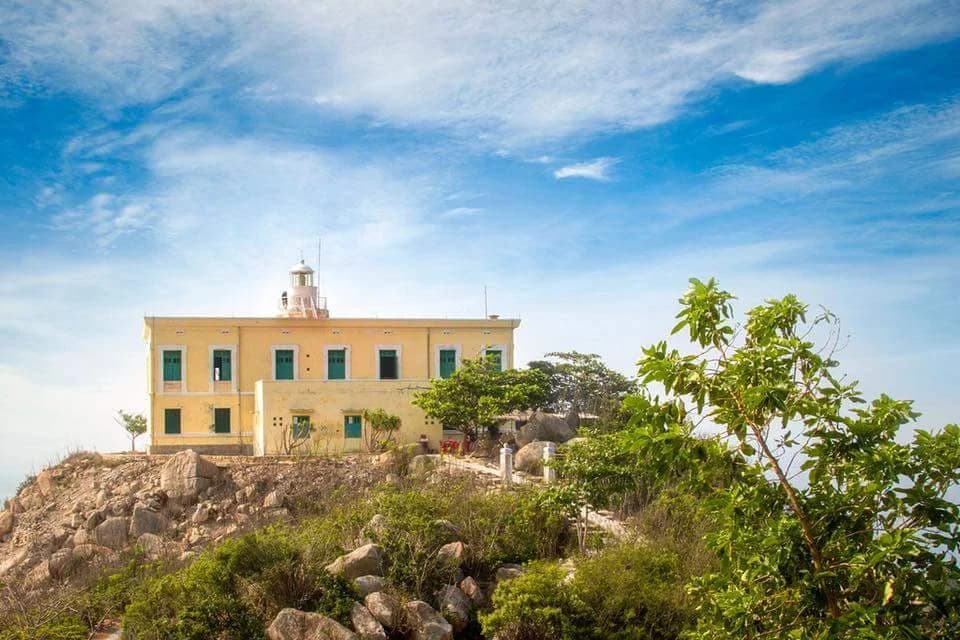 Ha Long Bay sunrise with misty limestone islands