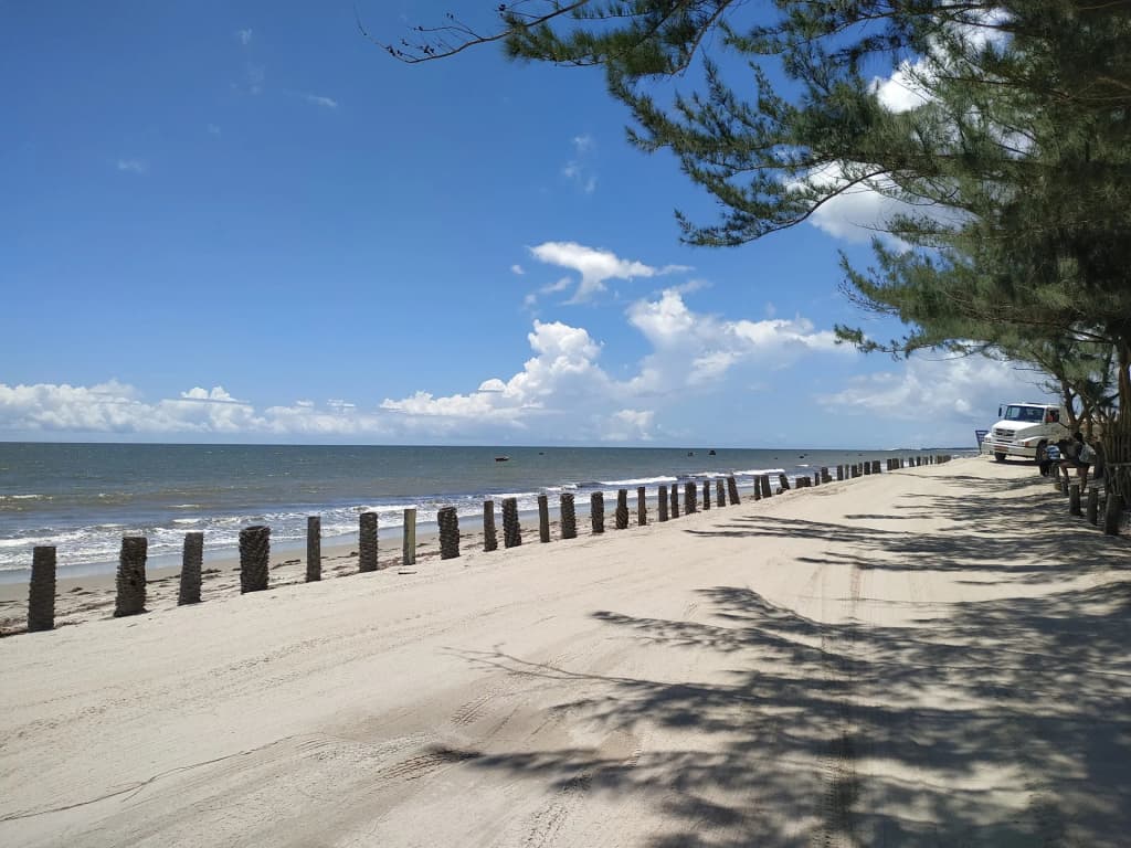 Kitesurfers and wild dunes at Praia de Cumbuco, Ceará