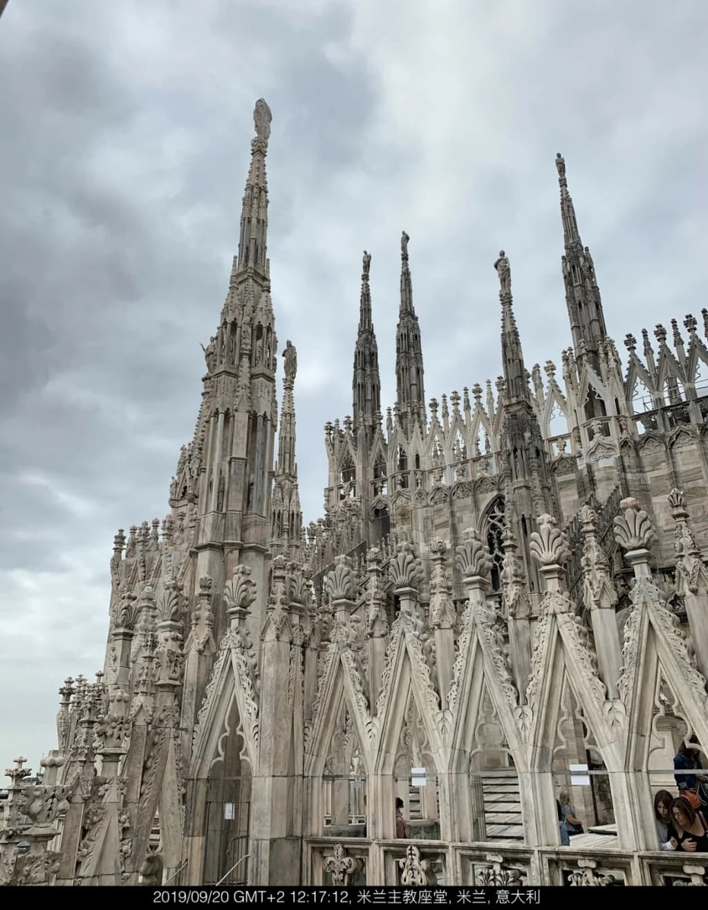 Castello Sforzesco’s red-brick towers and inner courtyard, people strolling