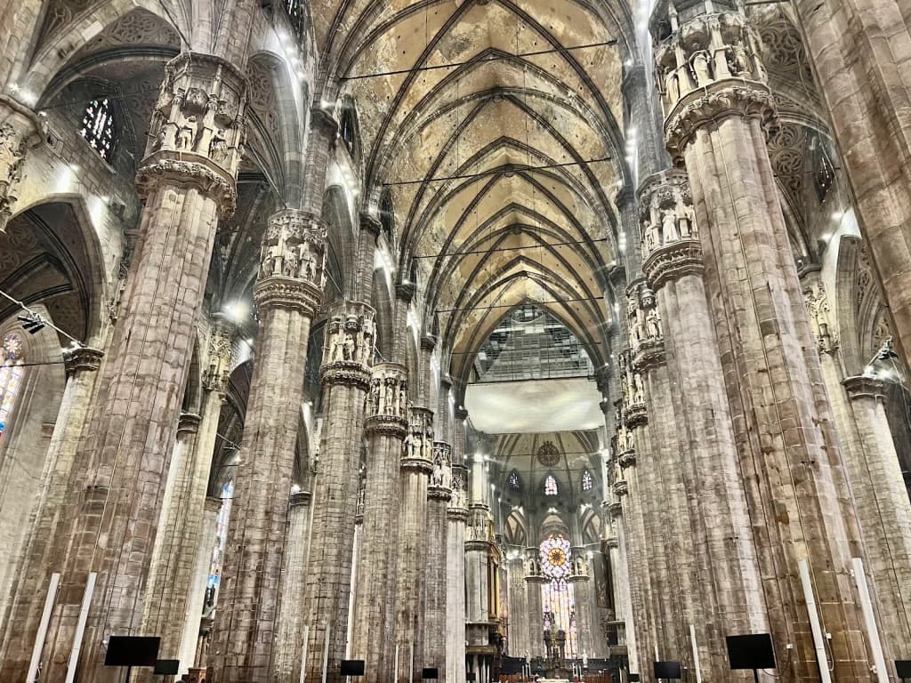 Navigli canal at sunset, bars and people along the water, golden light