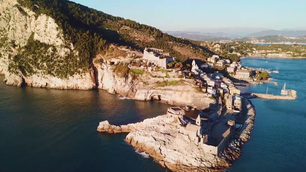 Colorful houses perched on a cliff above the Mediterranean in Cinque Terre