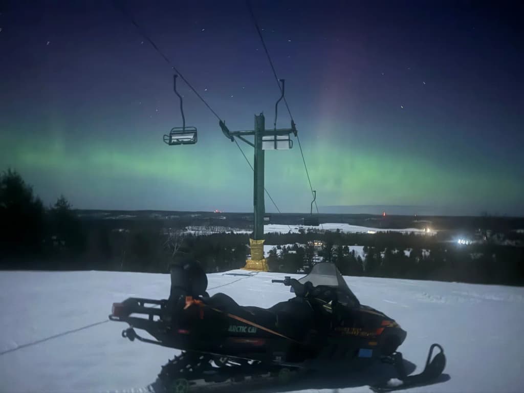 Jagged Norwegian mountains rising from a deep blue fiord